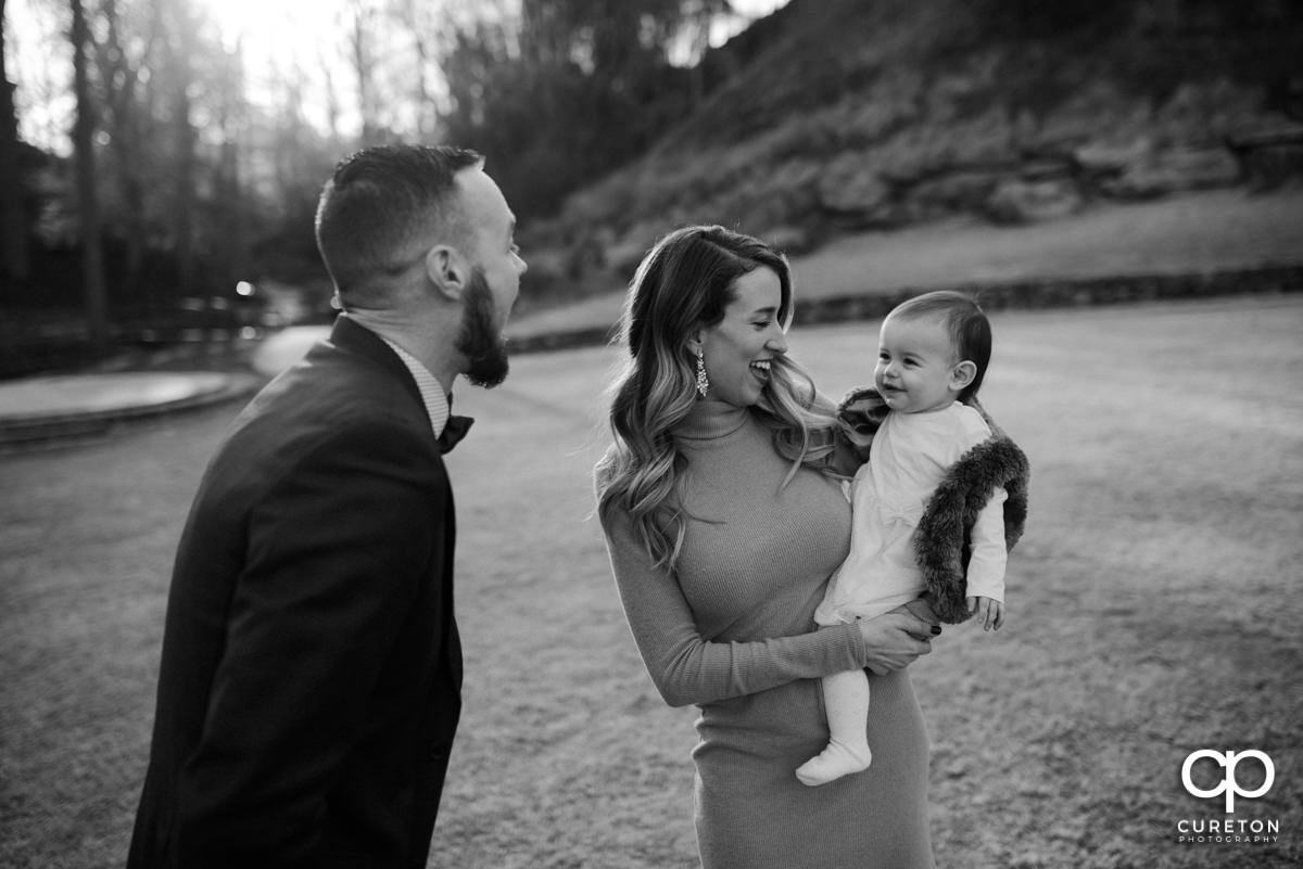 Father making his daughter laugh.