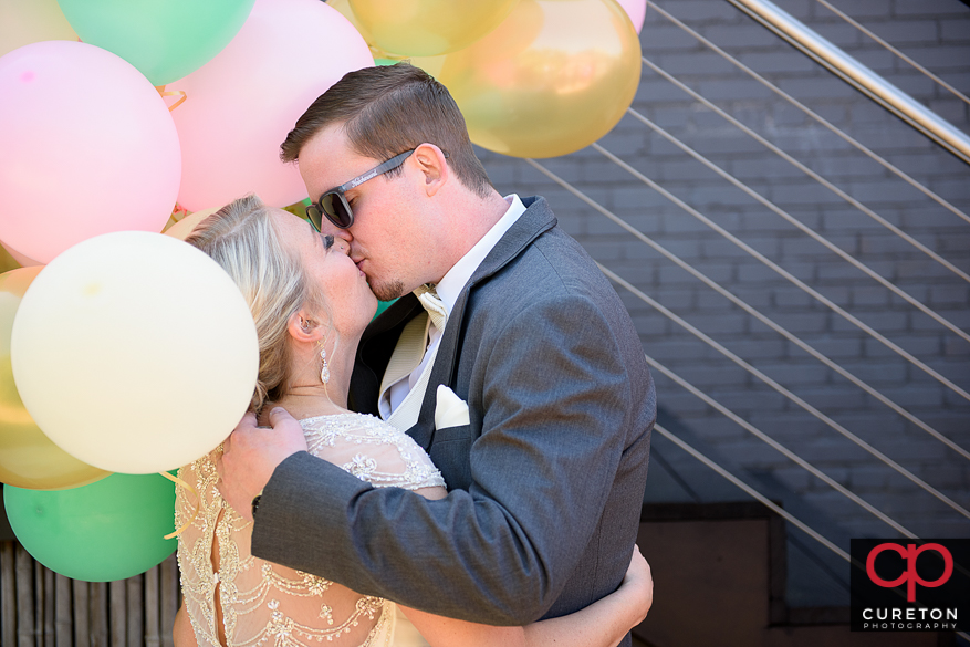 Groom kisses his bride during a first look.