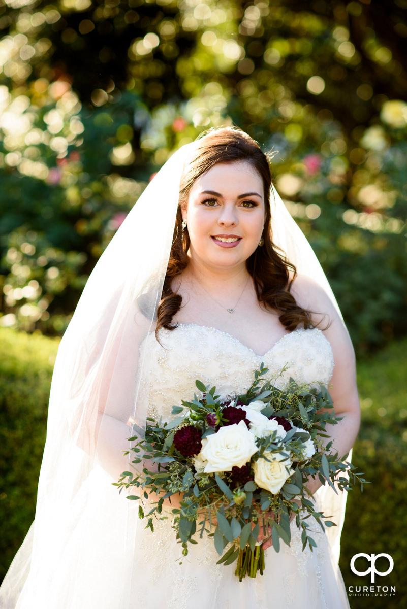 Beautiful bride in the rose garden at Furman University.
