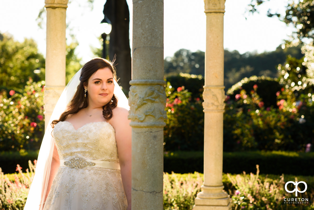 Bride in glowing sunlight during a golden hour bridal session.