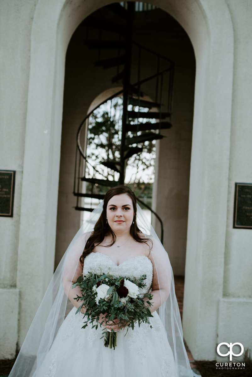 Bride in front of the bell tower at Furman University.