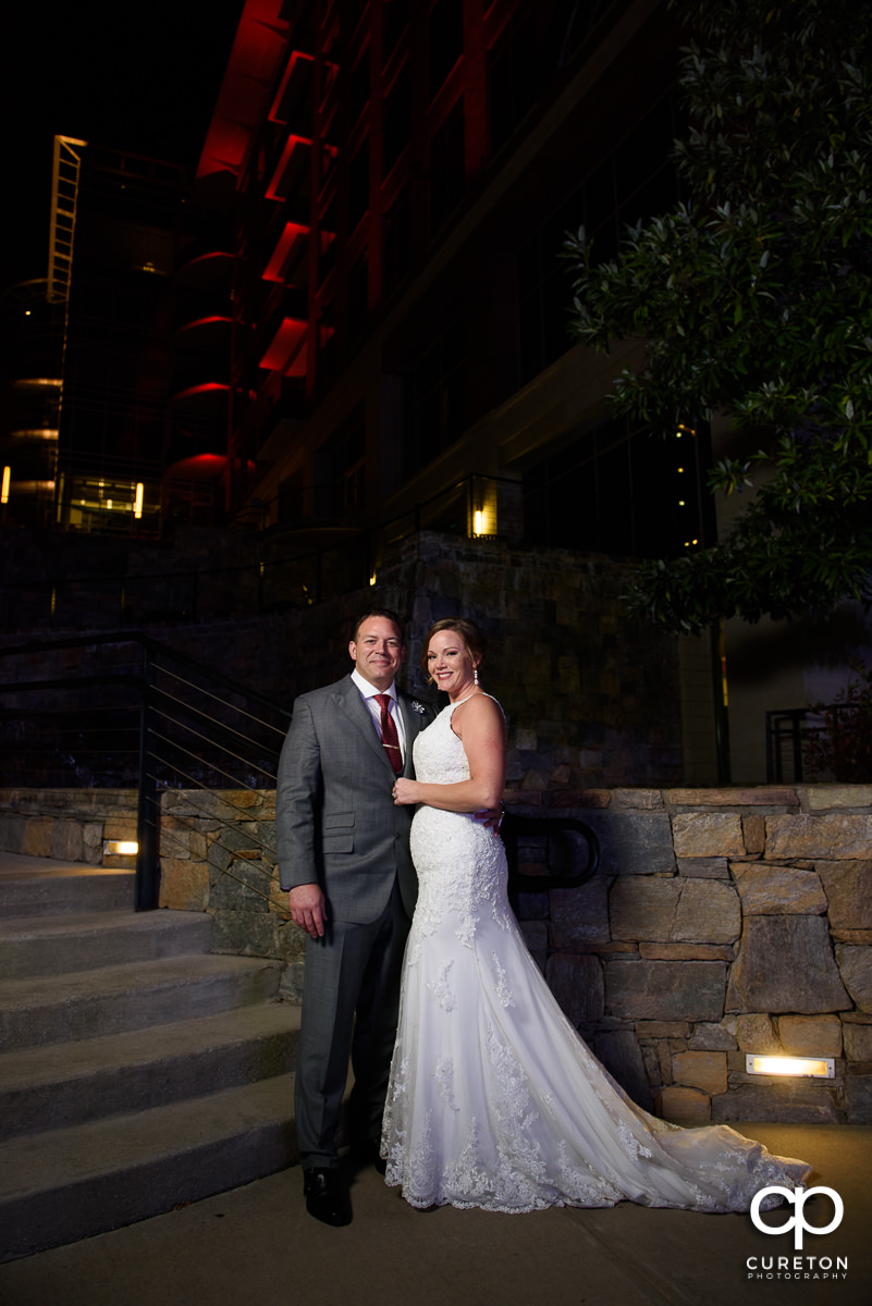 Newlywed couple outside The Lazy Goat in downtown Greenville,SC.