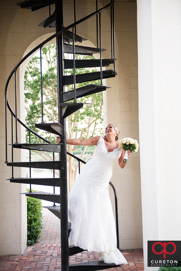 A bride on the staircase at the Bell Tower at the Furman campus.