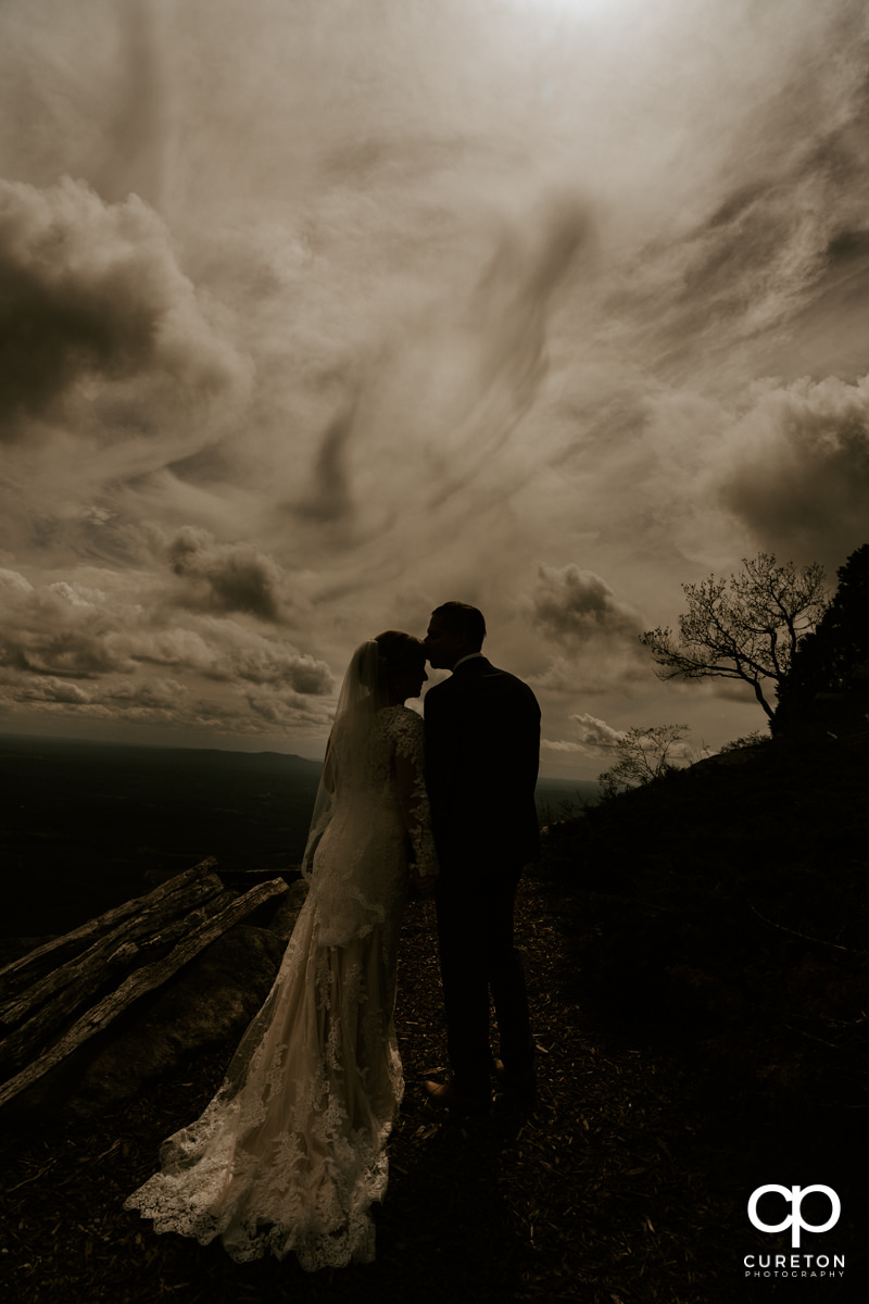 Silhouette of a bride and groom after their wedding at Glassy Chapel.