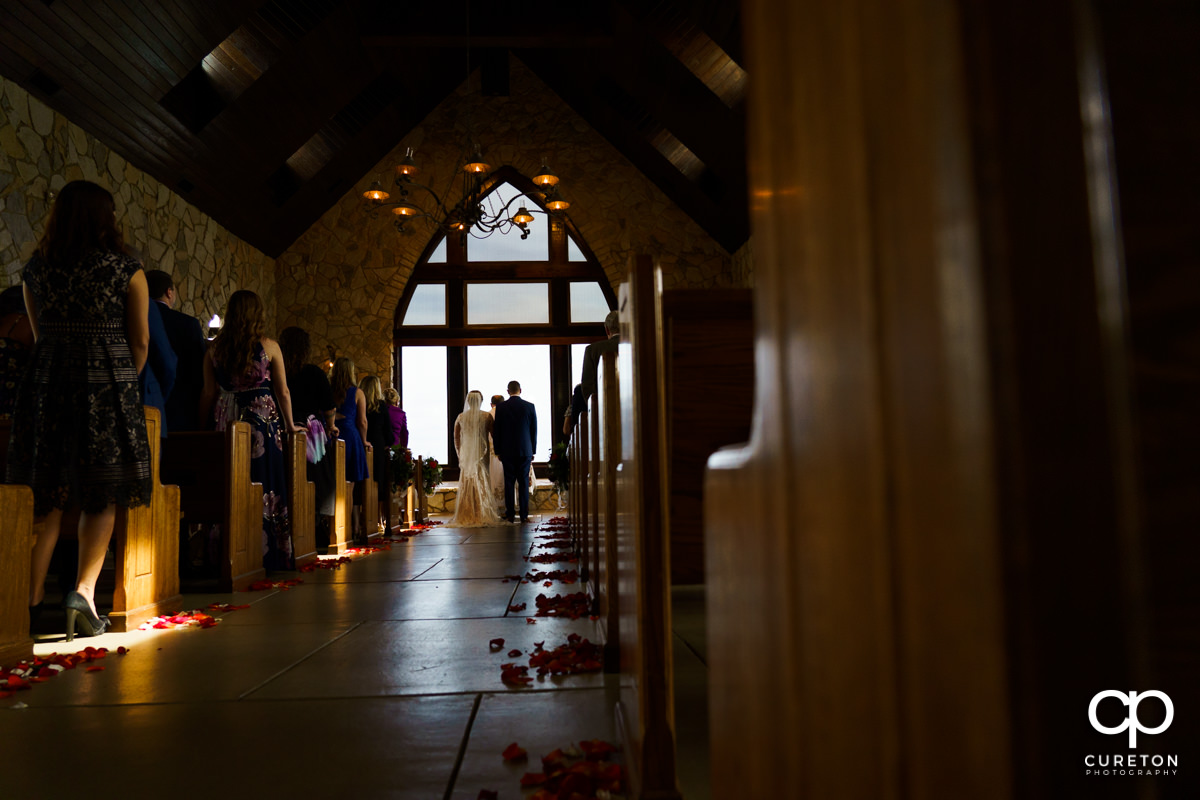 Bride and groom at the altar during a Ukrainian Catholic wedding ceremony at Glassy Chapel in Landrum,SC.