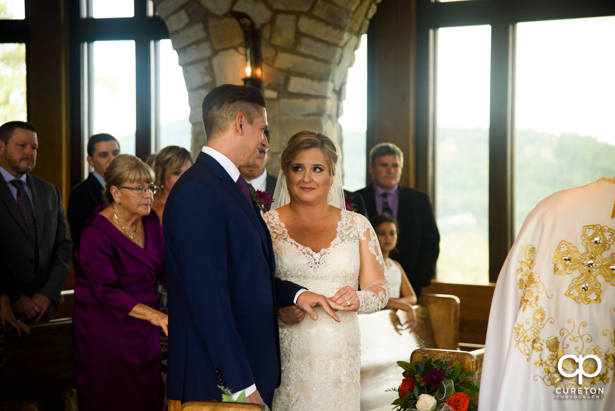 Bride and groom gazing at each other during the ceremony.