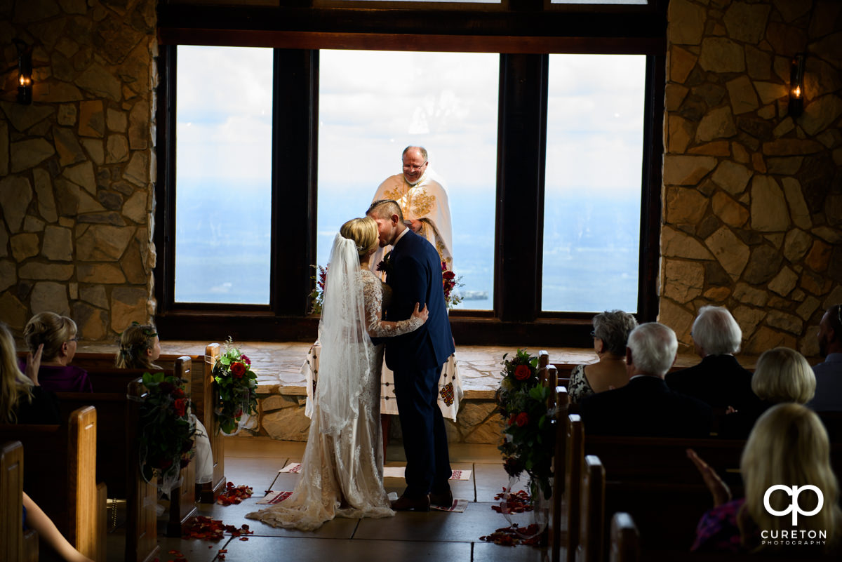 First kiss at the Glassy Chapel wedding ceremony.