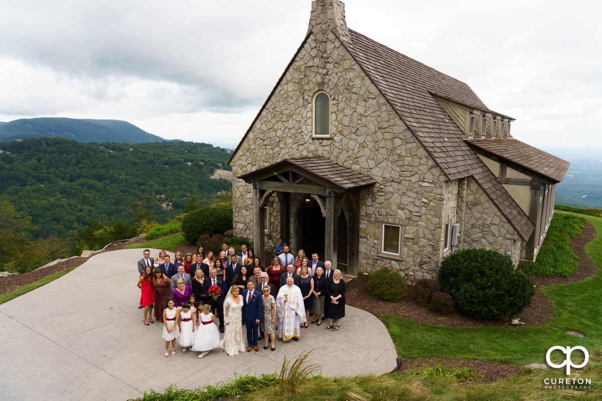 Wedding guests standing outside of the chapel.