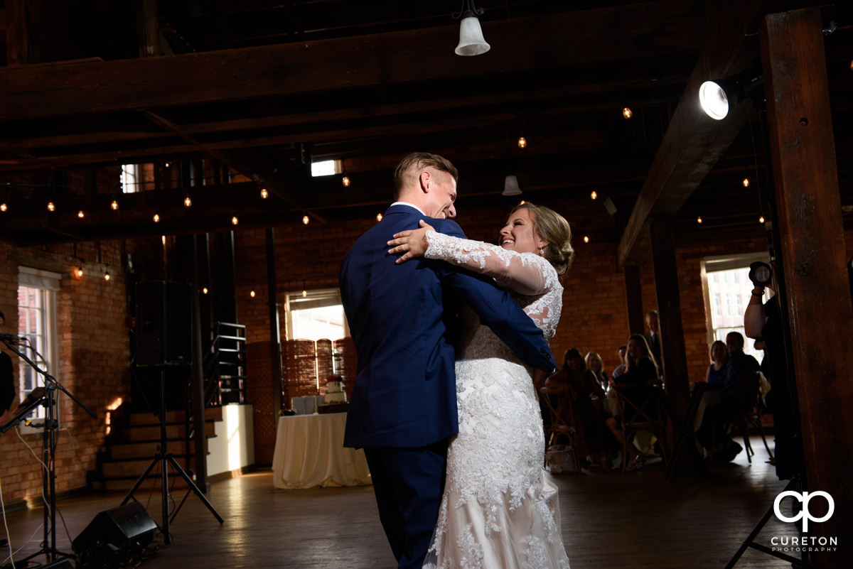 Bride and groom having their first dance at their Larkin's Cabaret Room wedding reception in downtown Greenville,SC.