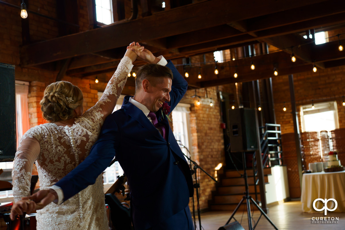 Bride and groom sharing a dance at their Larkin's Cabaret Room wedding reception in downtown Greenville,SC.
