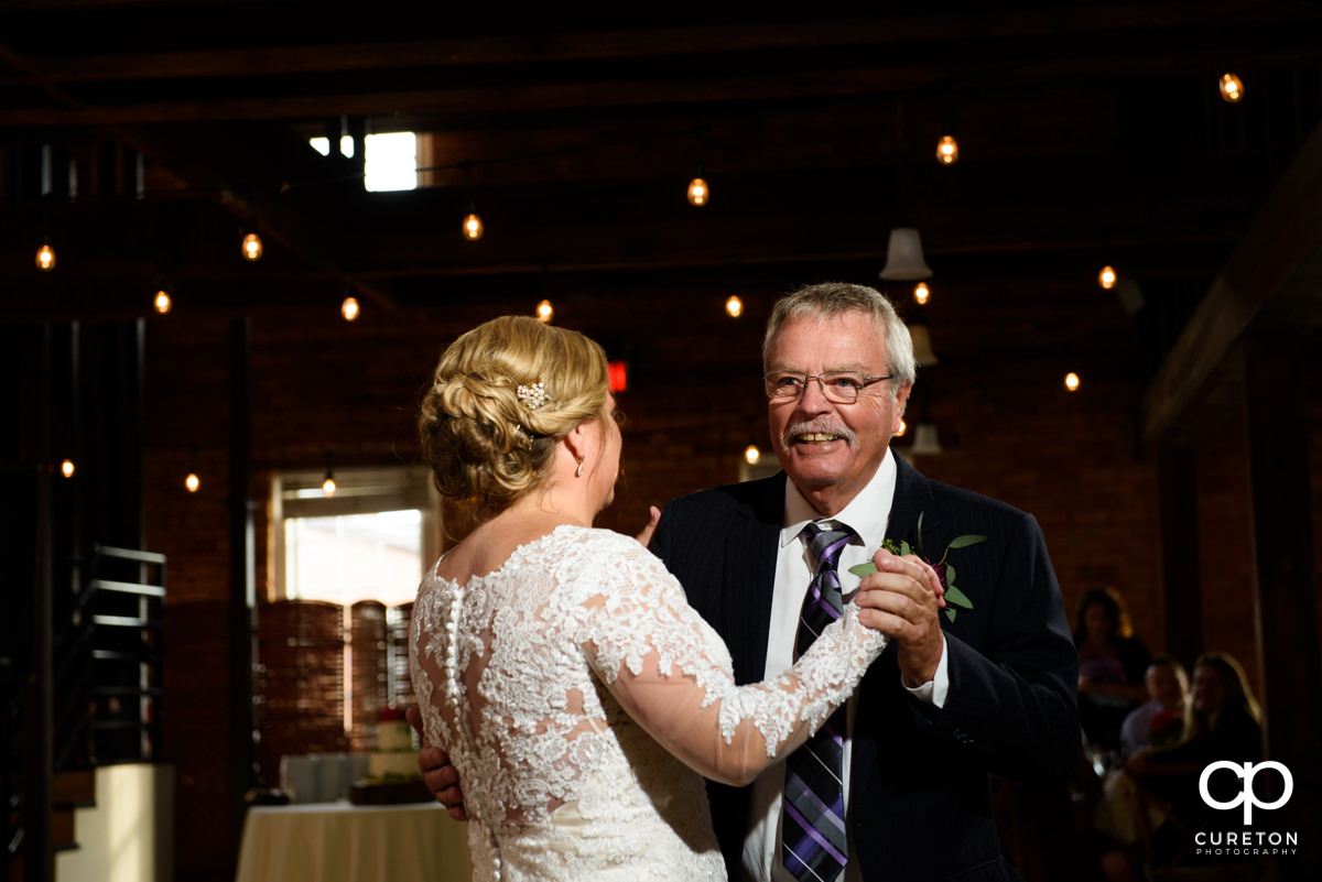 Bride sharing a dance with her father at their Larkin's Cabaret Room wedding reception in downtown Greenville,SC.