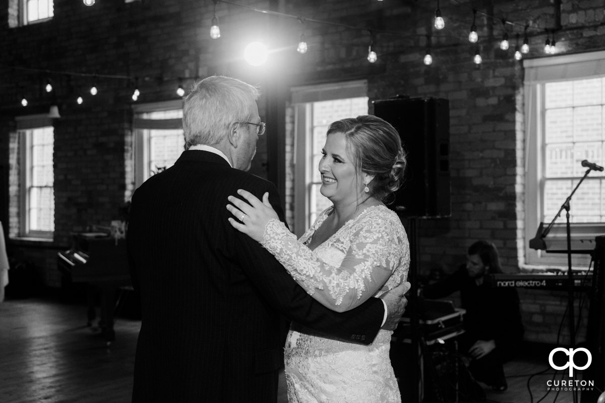 Bride sharing a dance with her father at the reception.