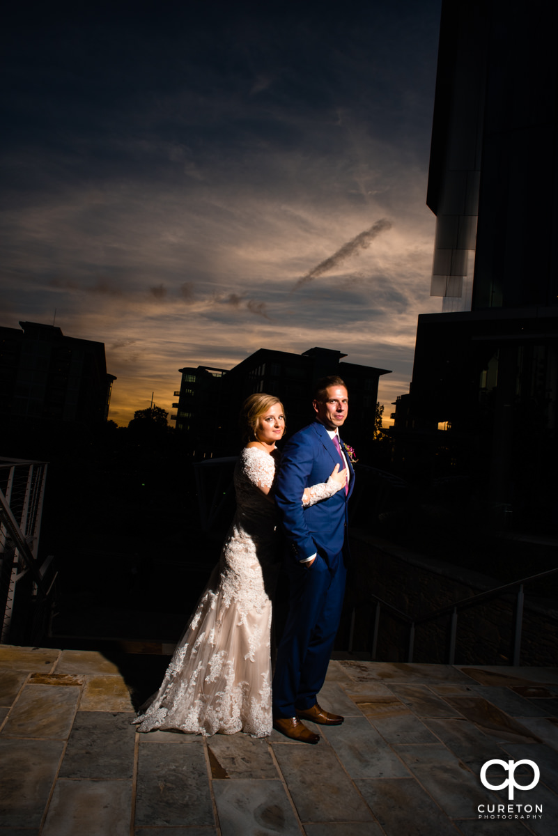 Bride and groom at sunset outside of their Larkin's Cabaret Room wedding reception.