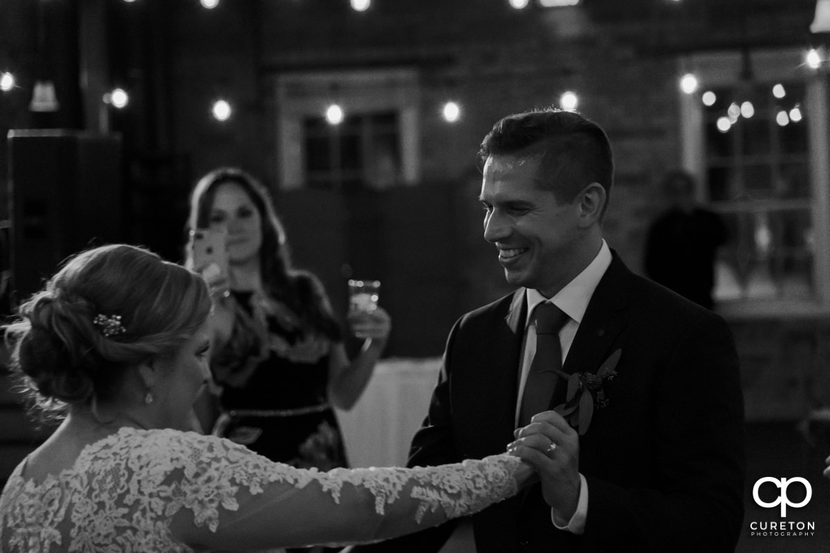 Bride and groom sharing a last dance at their wedding reception.