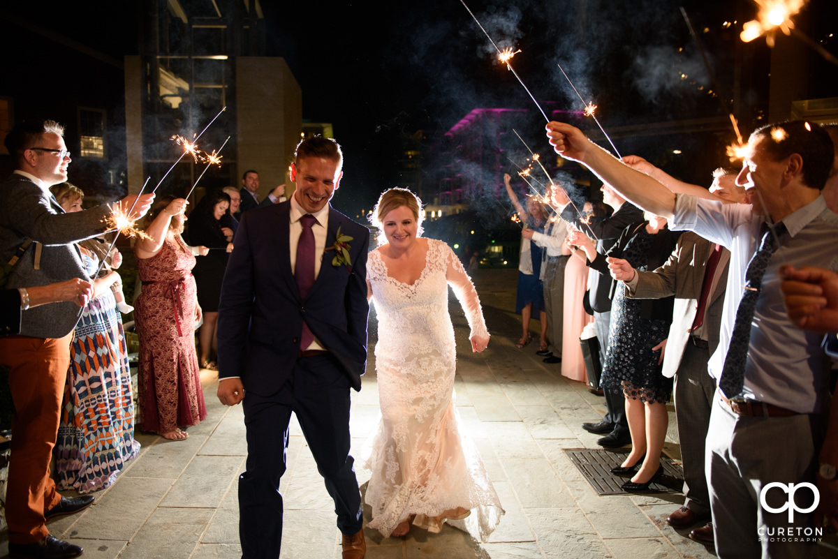 Bride and groom making a grand sparkler exit from their wedding reception at Larkin's Cabaret Room.