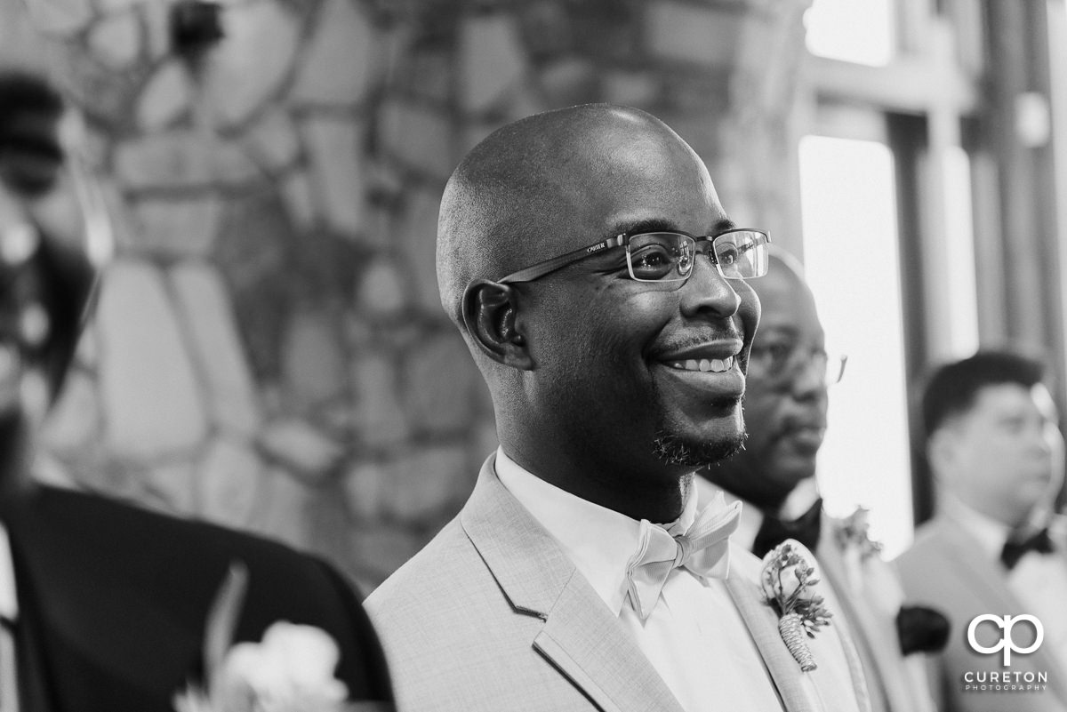 Groom's reaction seeing his bride walking down the aisle for the first time at Glassy Chapel.