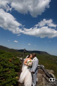 Bride and groom kissing at the Glassy Mountain overlook.
