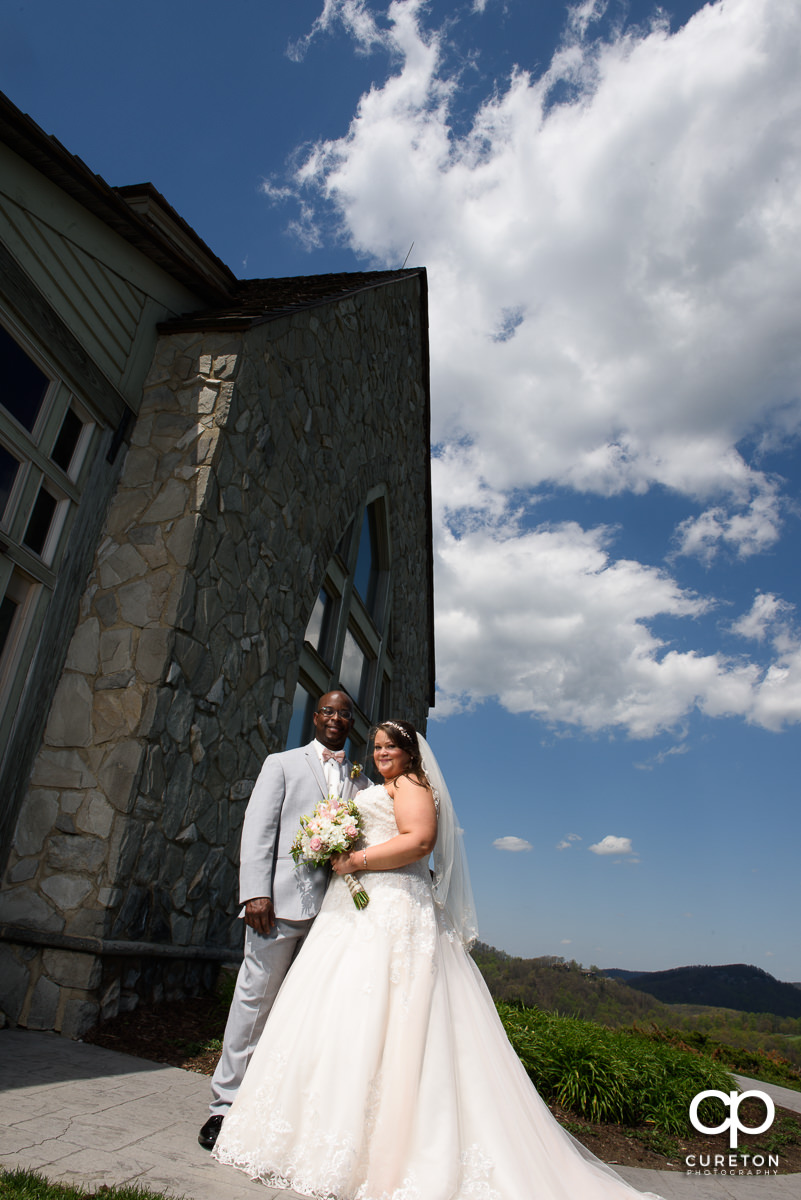 Bride and groom outside at the mountain top wedding chapel.