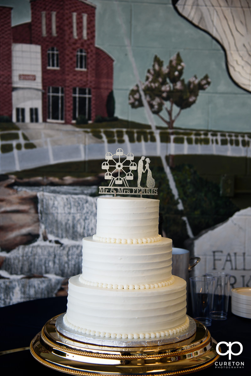 Wedding cake with custom ferris wheel topper.