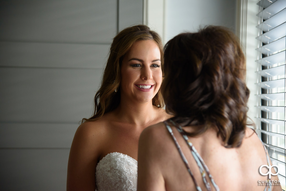 Bride smiling at her mother.