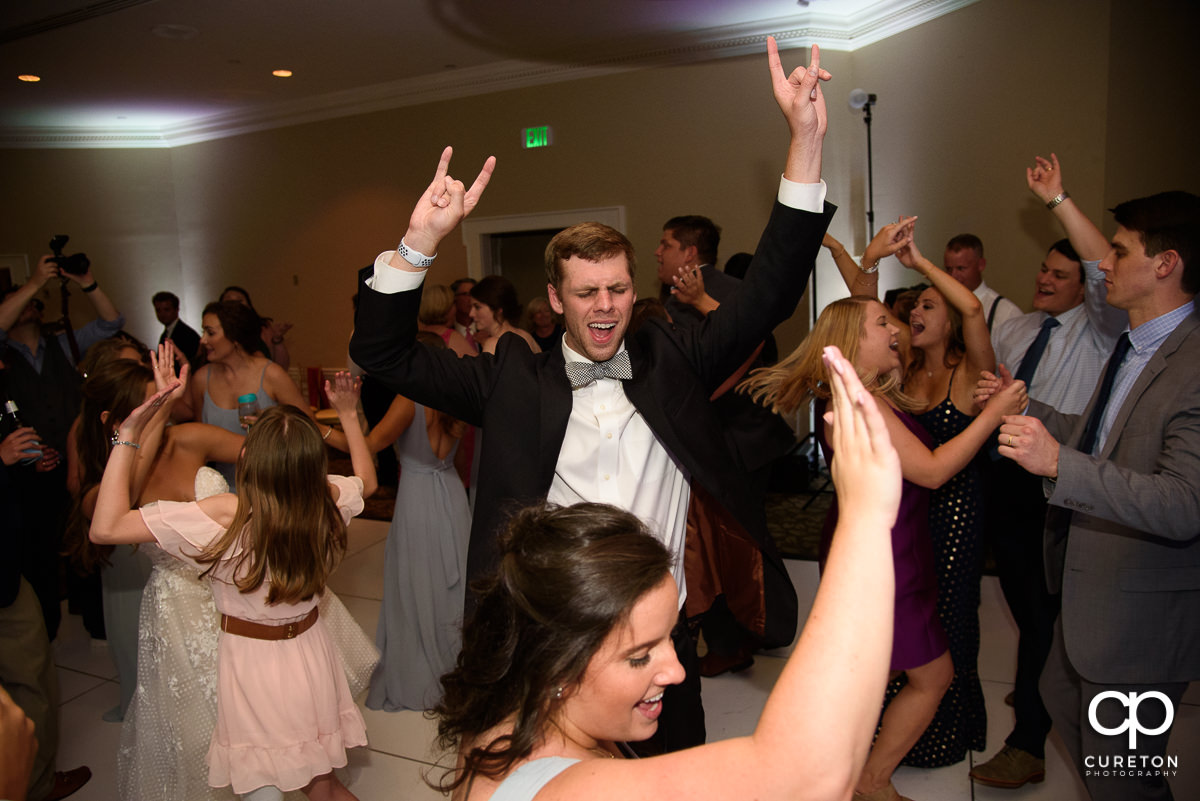Guests dancing at a Commerce Club wedding reception.