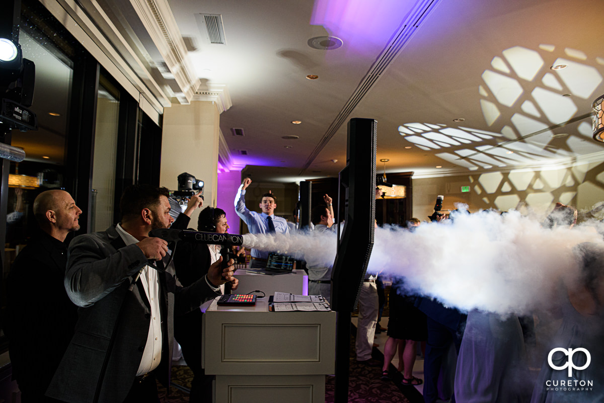 DJ Justin Reid from Uptown Entertainment firing a Club Cannon at a wedding reception in Greenville.