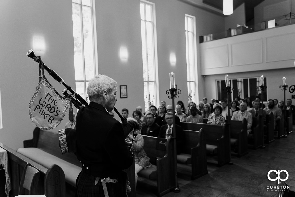 Bagpiper playing at the wedding ceremony.