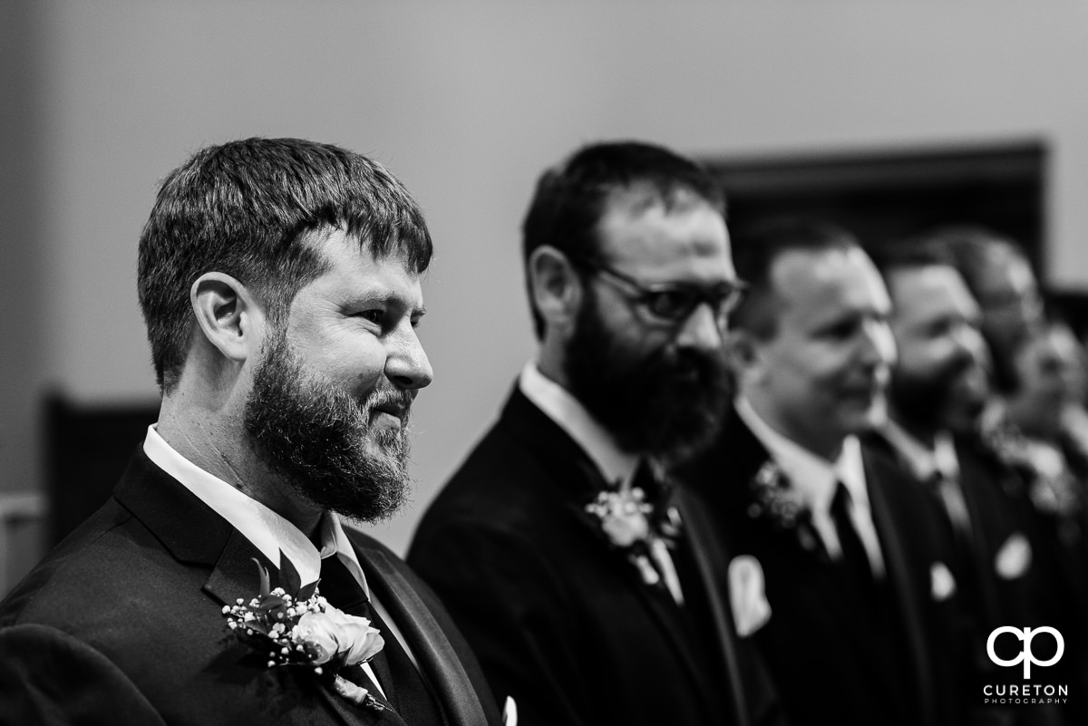 Groom seeing his bride for the first time.