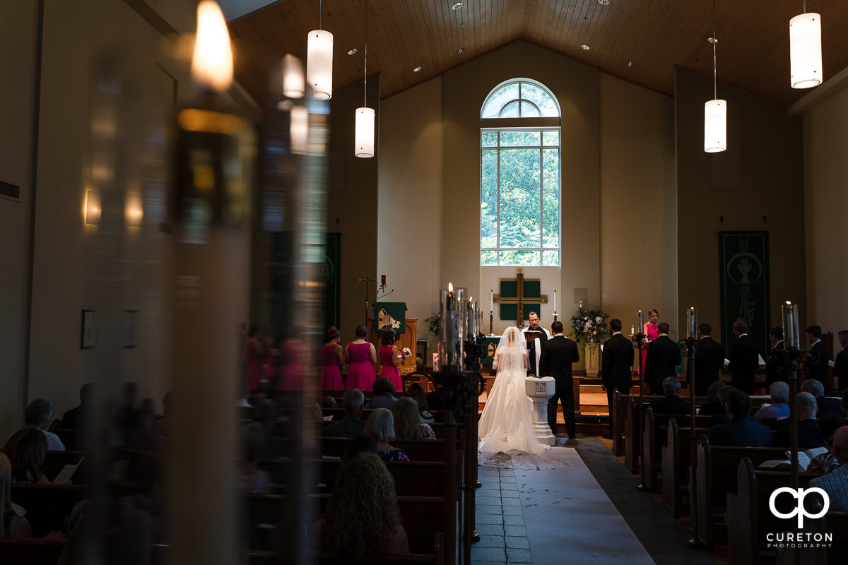 Bride and groom at the alter during the ceremony.