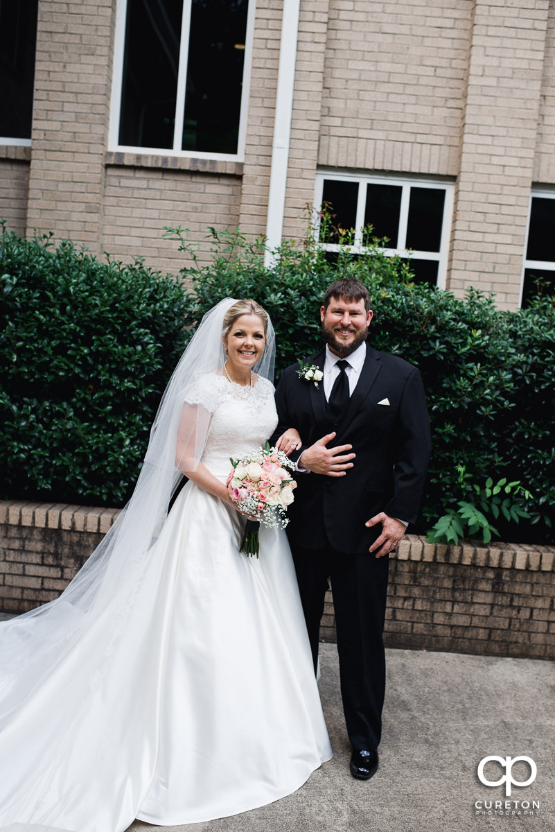 Bride and groom outside of the church wedding ceremony.