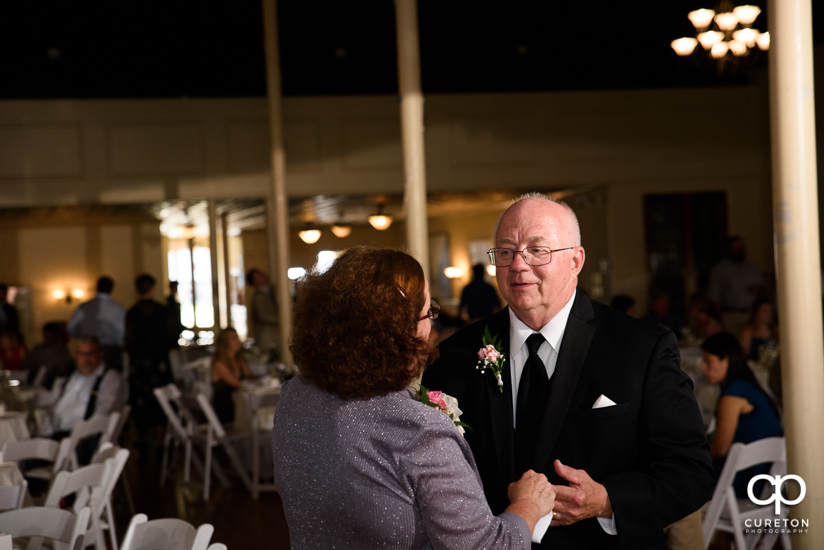 Bride's parents dancing at the reception.