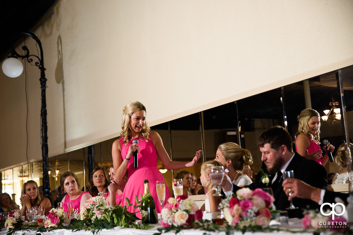 Maid of honor giving a speech.