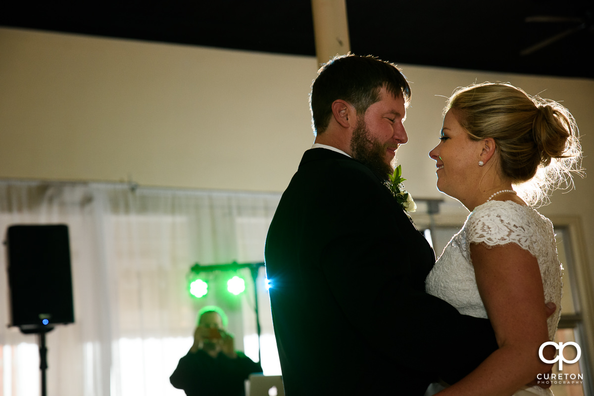 Bride and groom sharing a dance.