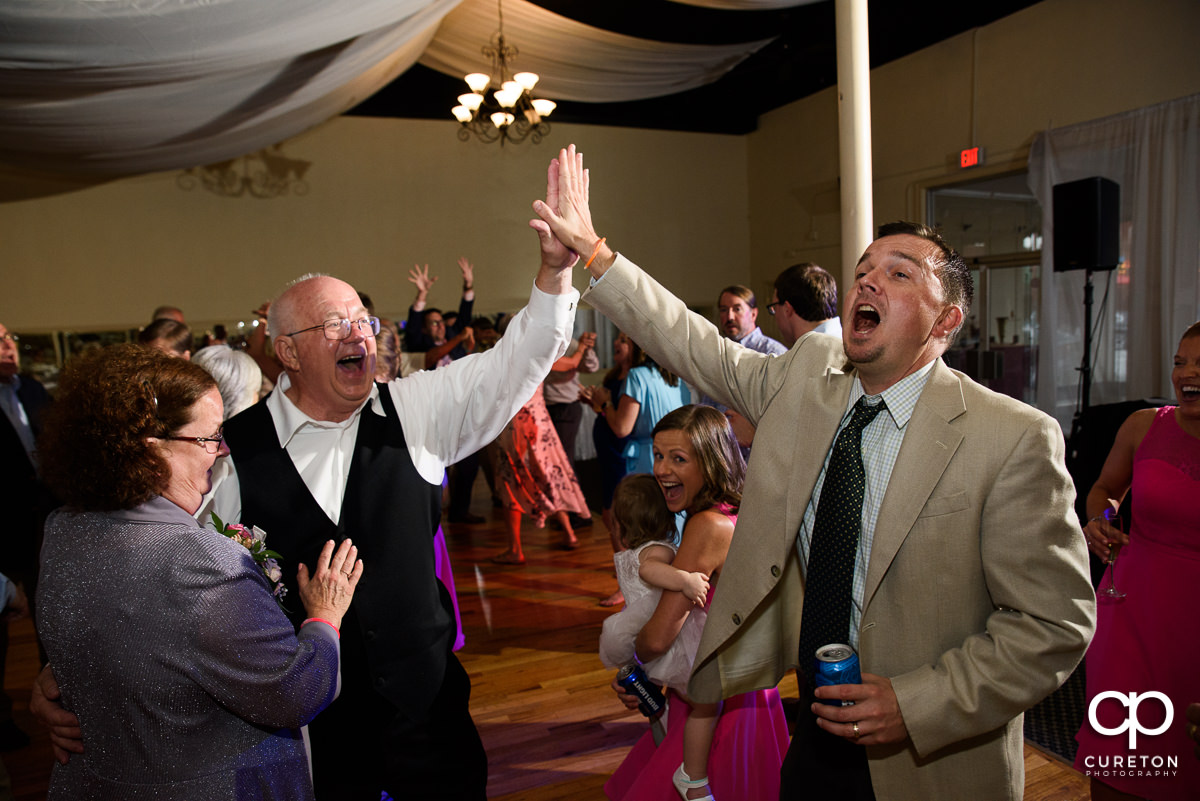 Guests dancing at the Grace Hall wedding reception to the sounds of DJ Sam from PPE Event Group.