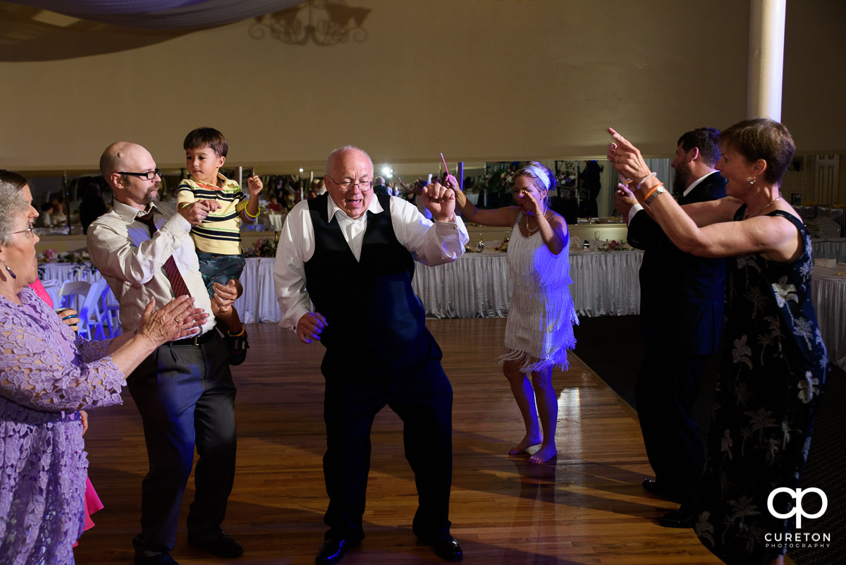 Guests dancing at the Grace Hall wedding reception to the sounds of DJ Sam from PPE Event Group.