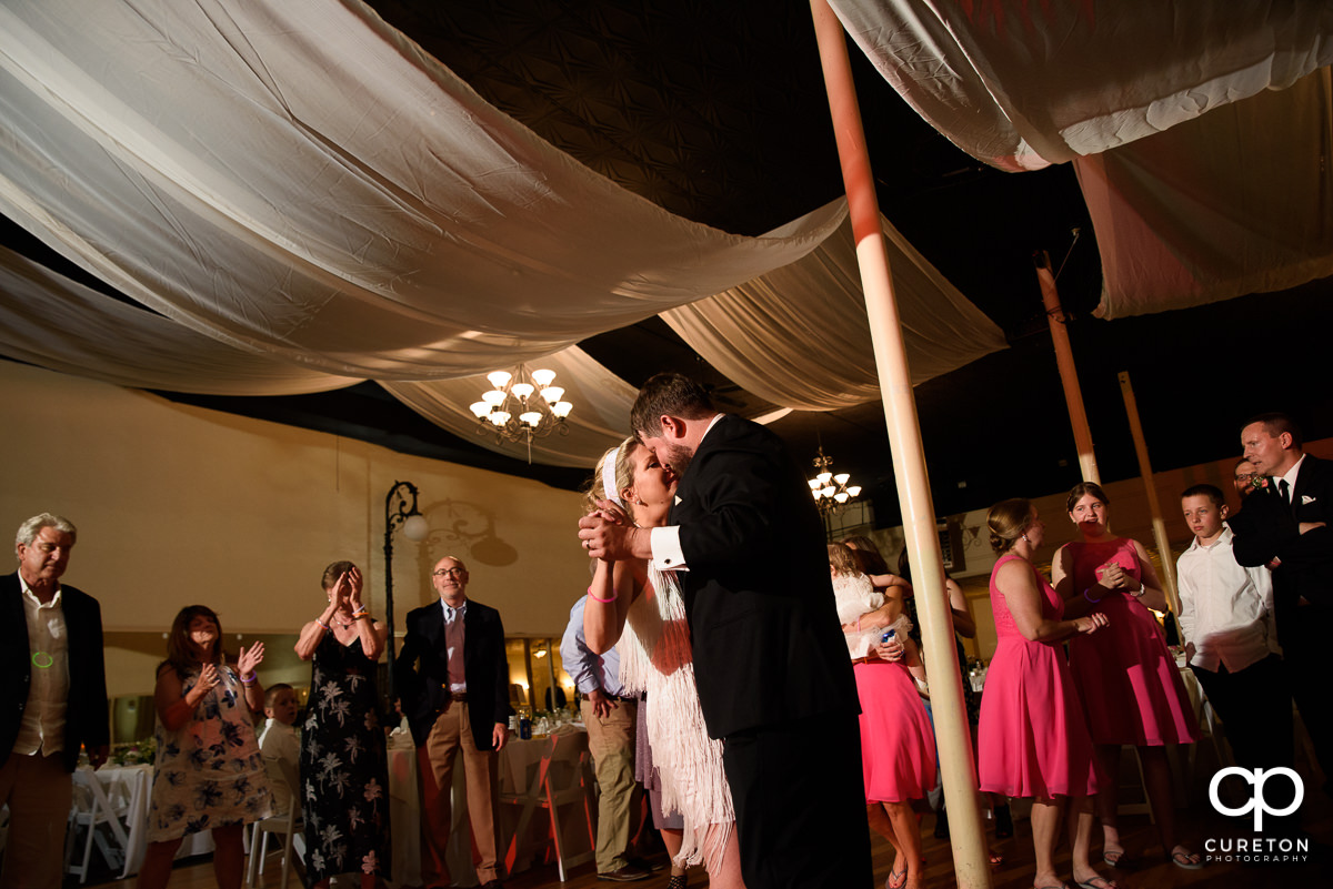 Bride and groom sharing a last dance.