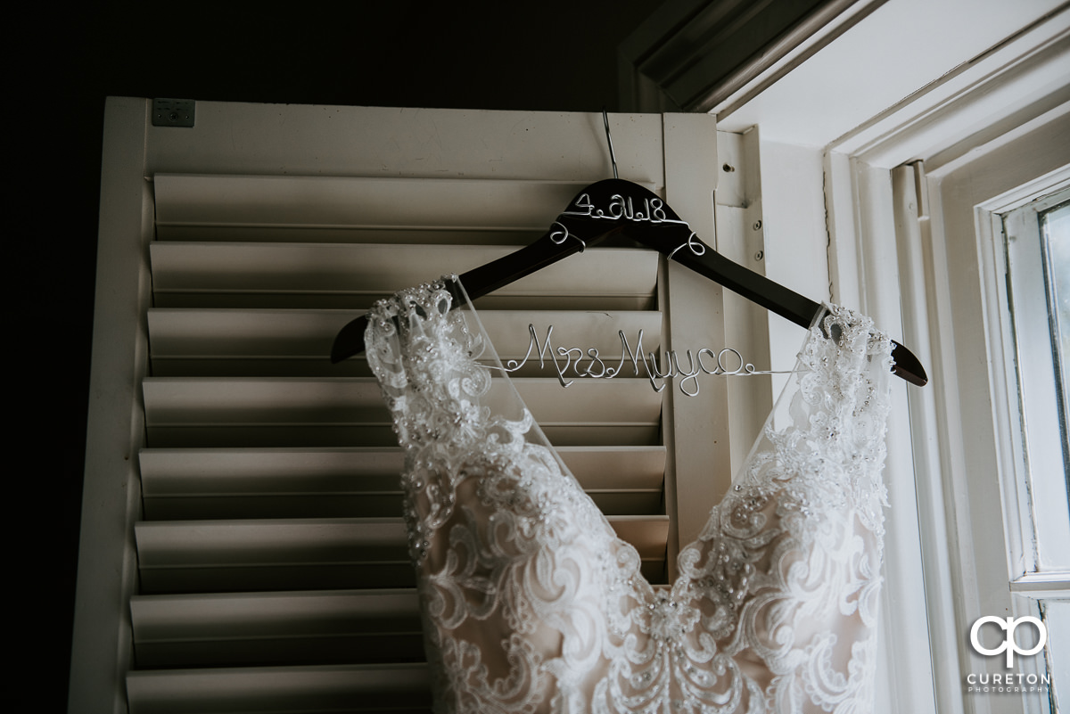 Bridal dress with custom hangar.