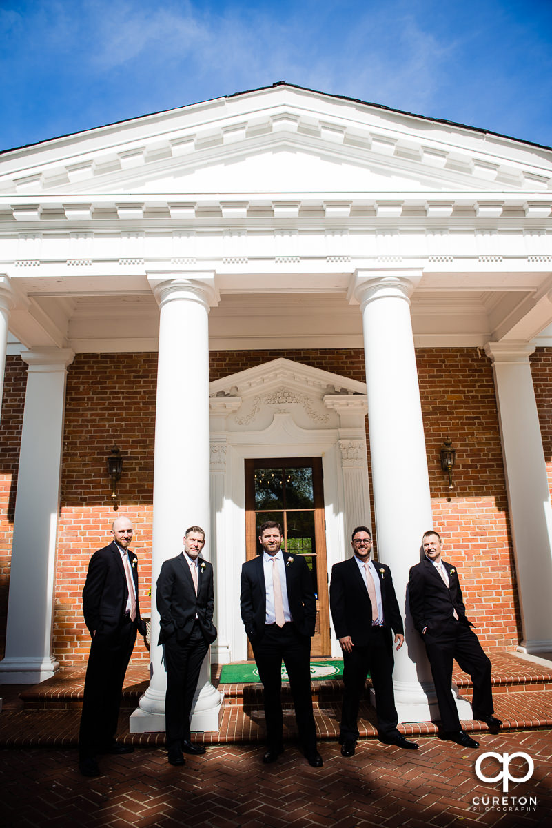 Groom and groomsmen on the steps at Green Valley Country Club before the wedding.