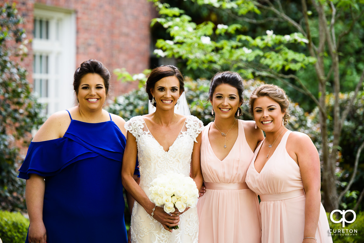 Bride and the bridesmaids outside of the chapel.