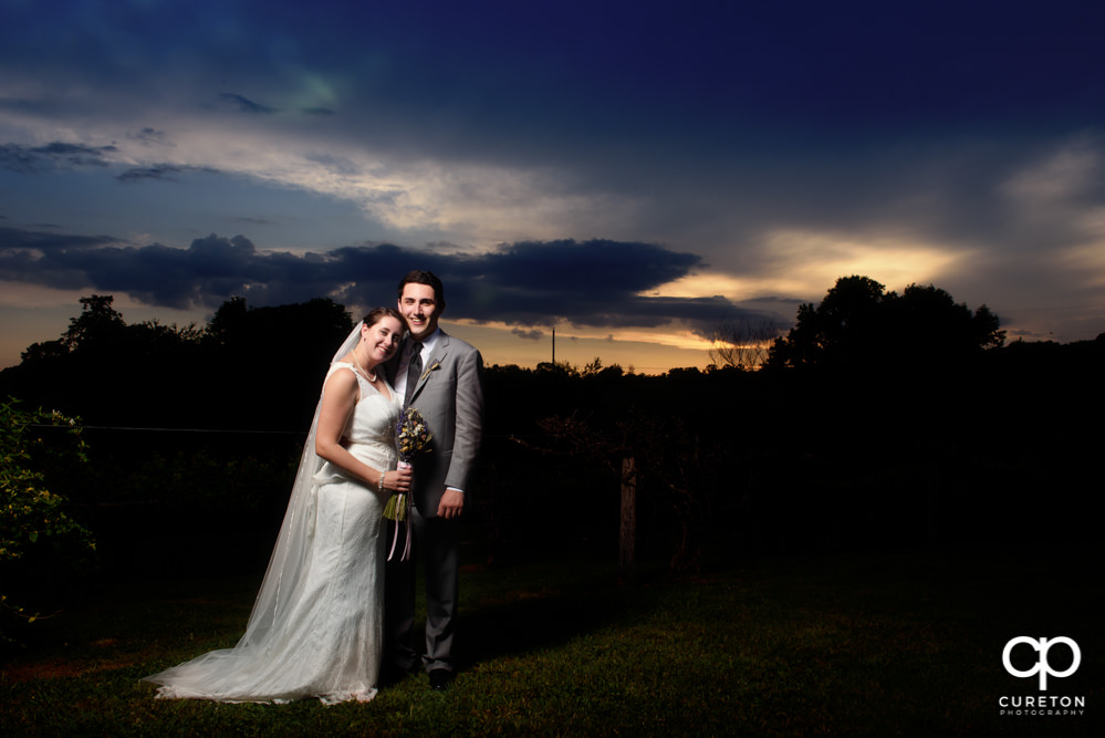 Bride and groom in front of an epic sunset.