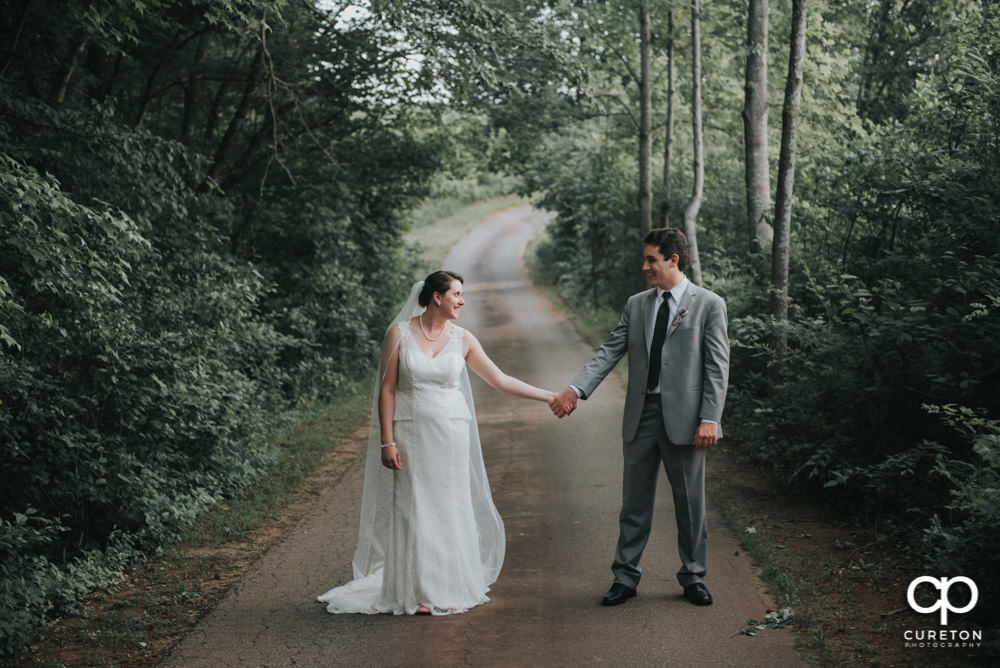 Bride and groom on a backroad after their wedding in Easley SC.