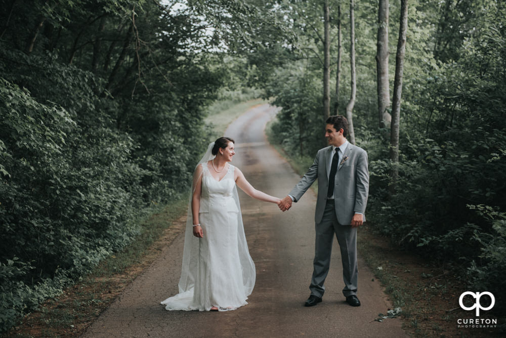 Bride and groom on a backroad after their wedding in Easley SC.