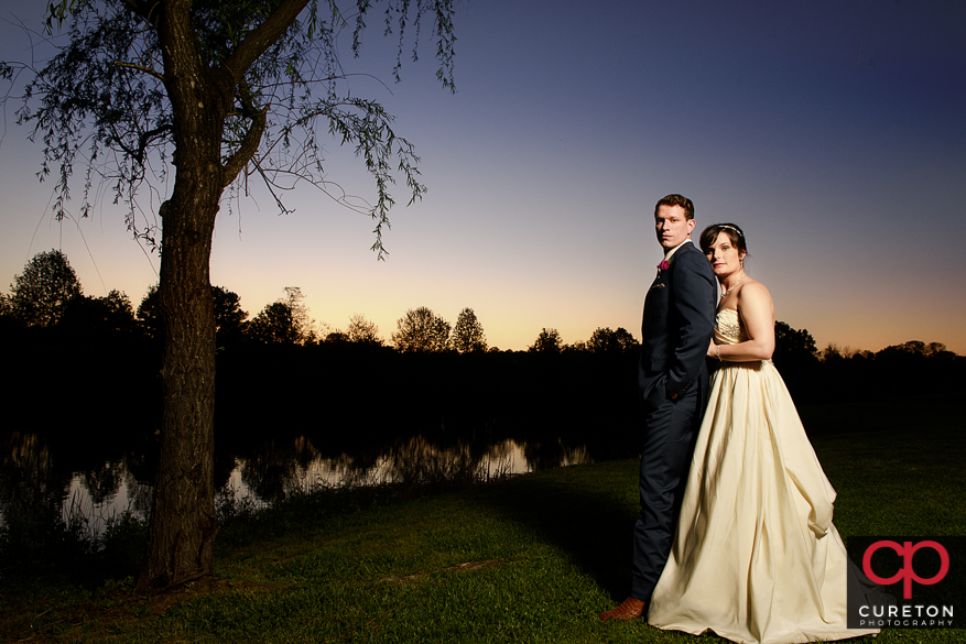 Bride and Groom at sunset at their Greenbrier Farms wedding reception.
