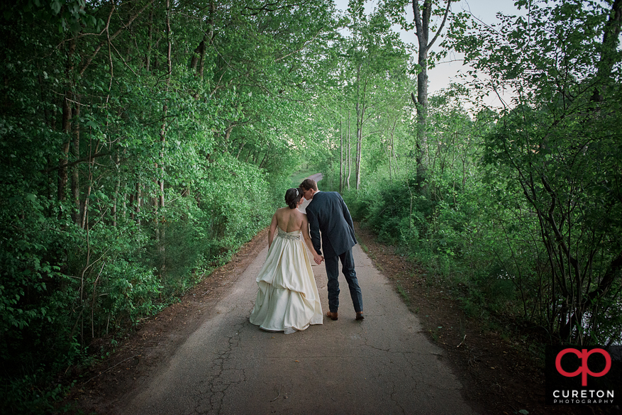 Couple kissing after their rustic farm wedding near Greenville,SC.