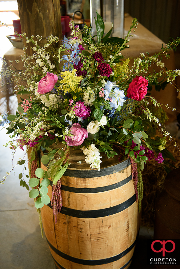 Flowers by willow floral on a whickey barrel.