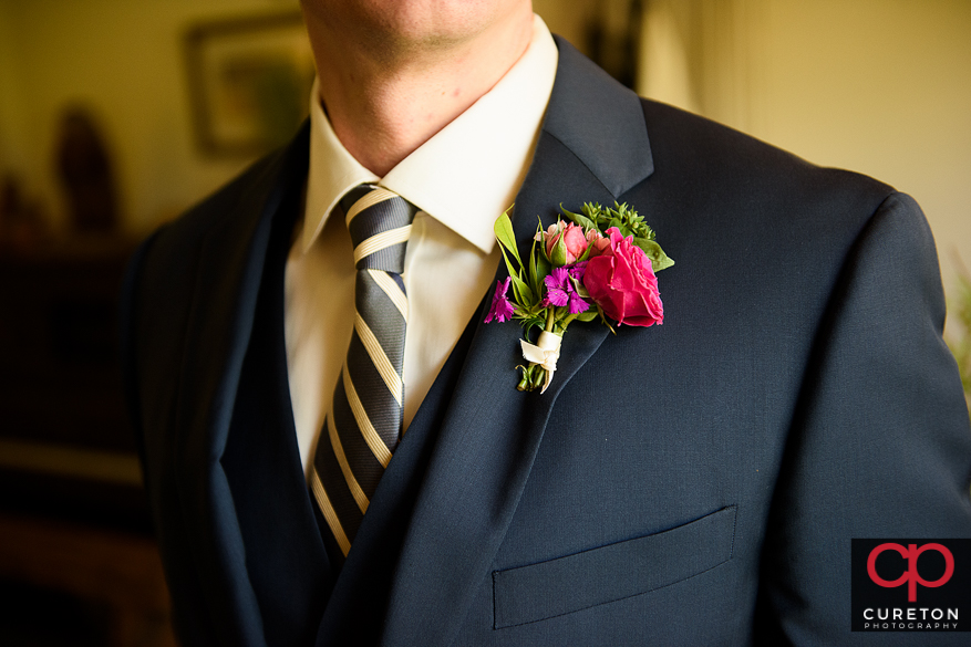 Closeup of the groom's flower.