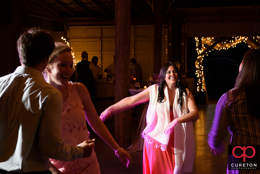 Guests dancing the night away as Uptown Entertainment plays music.