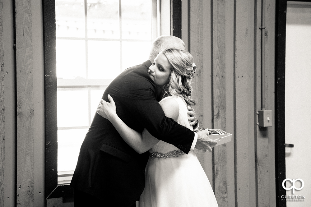 Bride and father first look before the wedding.