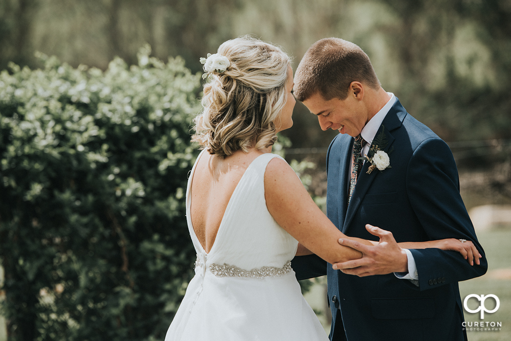 Bride and groom first look before their wedding at Greenbrier Farms.