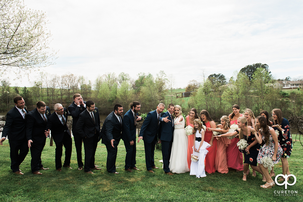 Wedding Party looking at the ring.